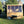 Load image into Gallery viewer, potting shed front view with wheel barrow